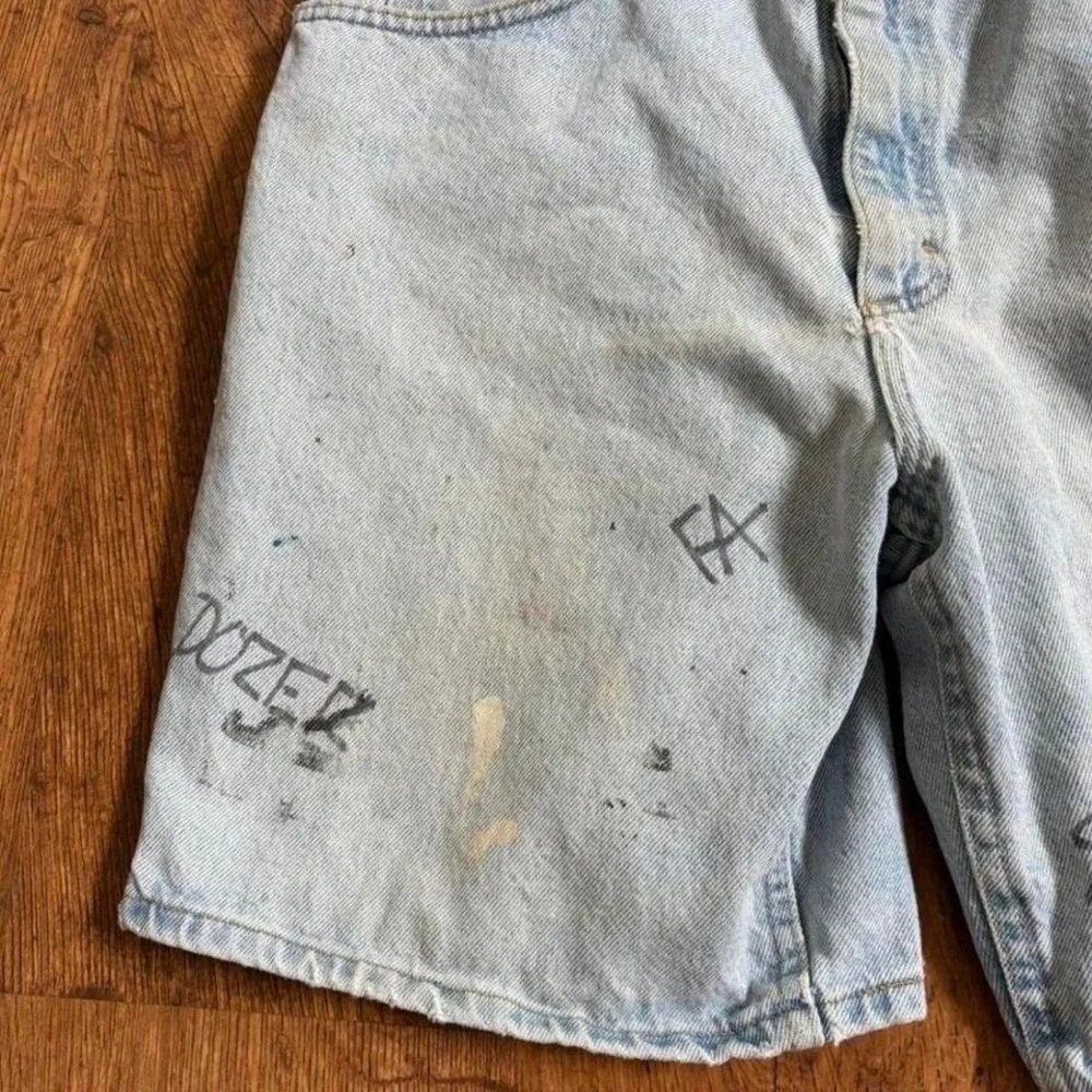 Lee blue denim shorts with paint marks and‎ writing, ultra faded